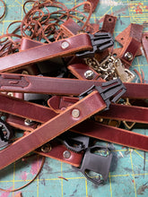 Brown chin straps